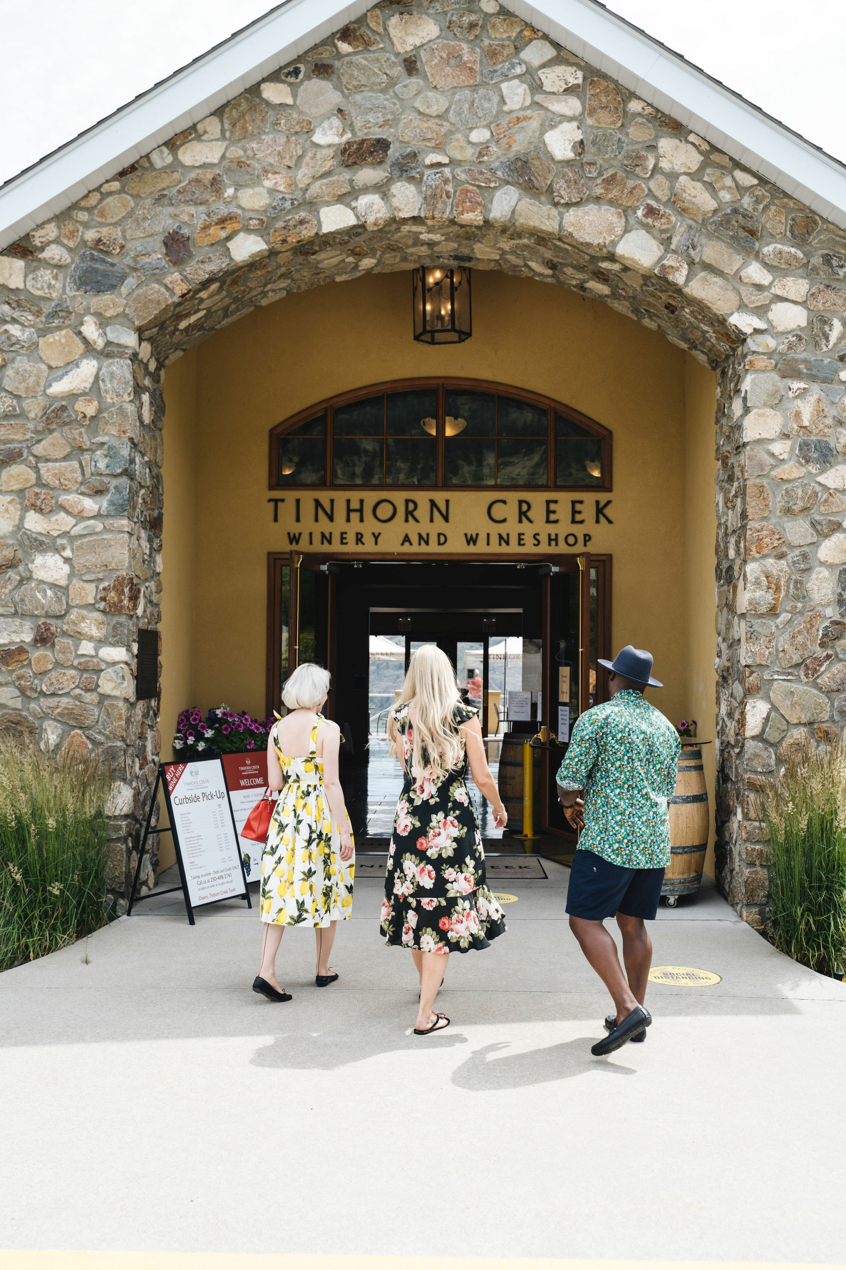 Three visitors walking into the Tinhorn Creek Winery and wineshop, located in the South Okanagan.